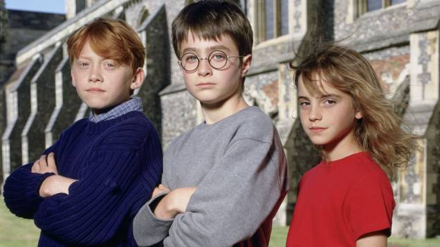 Ron Weasley (Rupert Grint), Harry Potter (Daniel Radcliffe) e Hermione Granger (Emma Watson), em 2001, no filme <em>Harry Potter e a Pedra Filosofal</em>