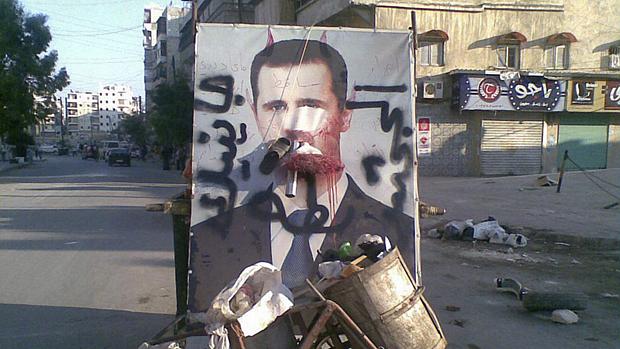 Quadro com imagem de Assad é vandalizado em rua de Alepo