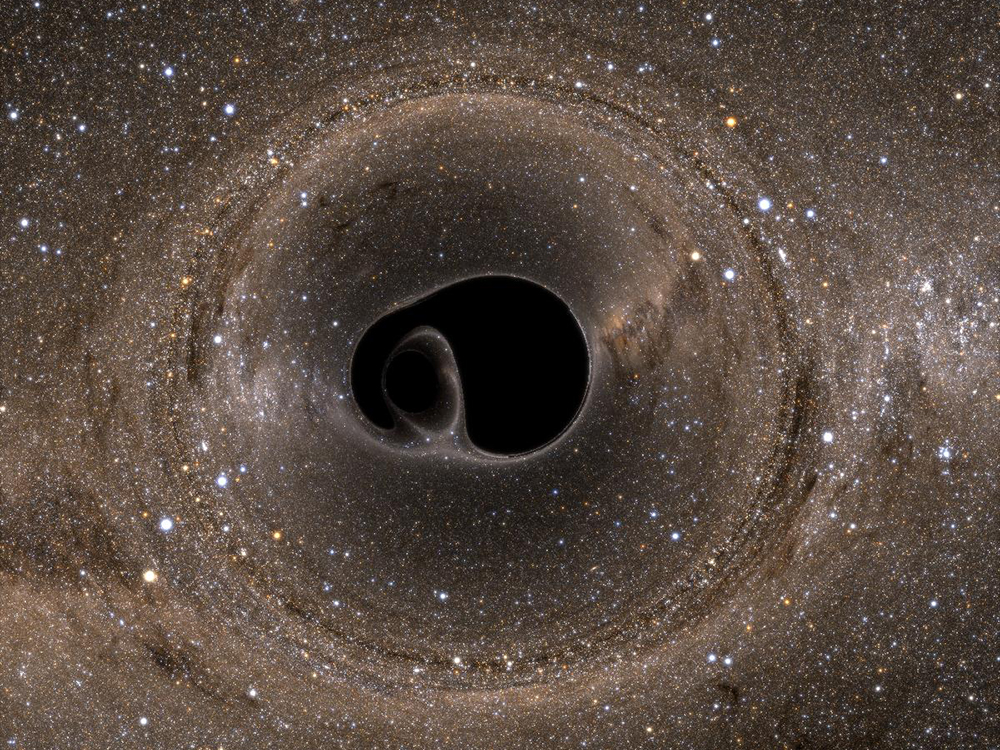 Simulação ilustra a fusão de buracos negros que causou as ondas gravitacionais que foram captadas pelo Observatório LIGO