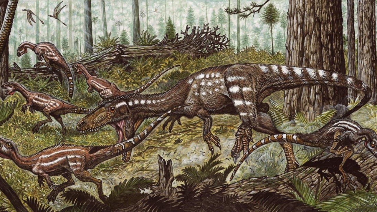 Ilustração do dinossauro 'Tachiraptor admirabilis', ao centro, caçando espécies menores