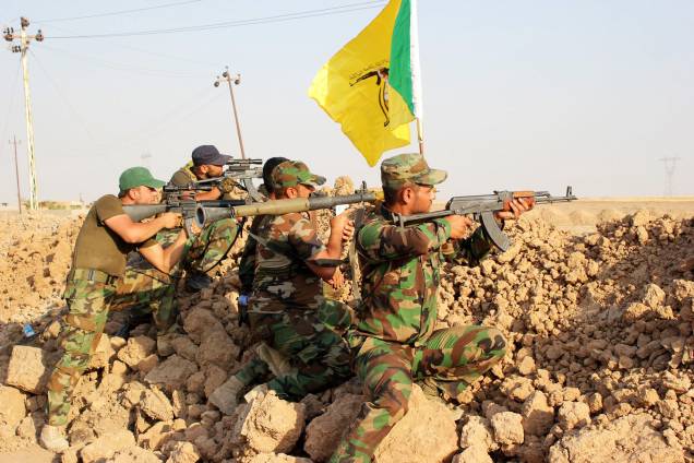 Voluntários Xiitas da milícia Hezbollah em combate contra o grupo extremista do Estado Islâmico na cidade de Amerli, Iraque - 01/09/2014