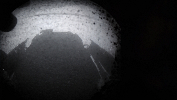 <p>Imagem divulgada pela Nasa mostra momento do pouso do jipe robô Curiosity em Marte</p>