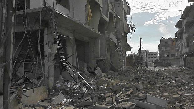 Prédios destruídos por bombardeios em Damasco