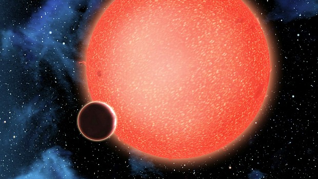 Concepção artística do GJ 1214b: uma super-Terra orbitando uma estrela anã vermelha a 40 anos-luz. Novas observações do Hubble mostram que o planeta é formado por vapor de água e uma espessa e fumegante atmosfera. Ele representa um novo tipo de planeta, nunca antes observado.