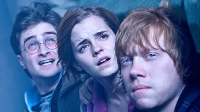 Harry, Hermione e Ron durante cena do filme <em>Harry Potter e as Relíquias da Morte: Parte 2</em>