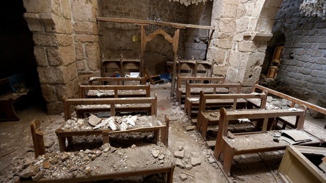 Uma igreja destruída é fotografada na cidade de Maalula, na Síria. O conflito no país já dura mais de três anos