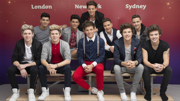 One Direction posa ao lado das estátuas de cera do grupo