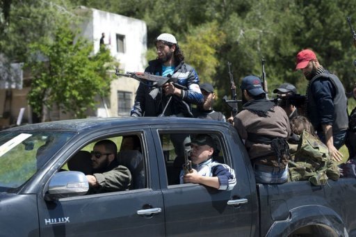 Membros da brigada al-Ezz bin Abdul Salamna província de Latakia, oeste da Síria, em 25 de abril de  2013