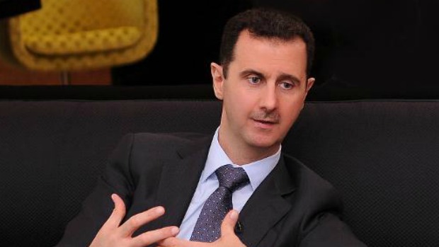 o ditador Bashar Assad. Sírio disse que ameaças não influenciaram sua decisão