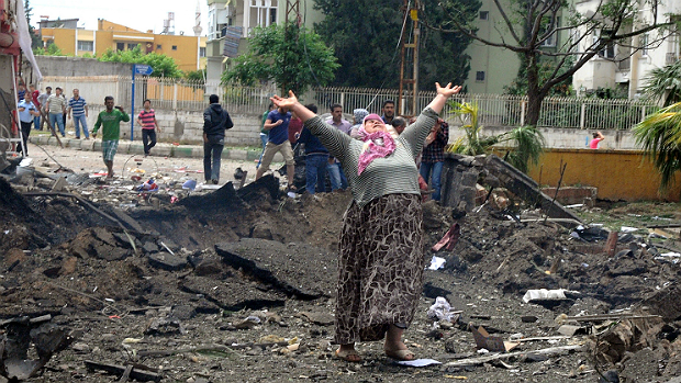 Local de uma explosões em Reyhanli, na Turquia, que puseram um prédio abaixo e mataram pelo menos 18 pessoas
