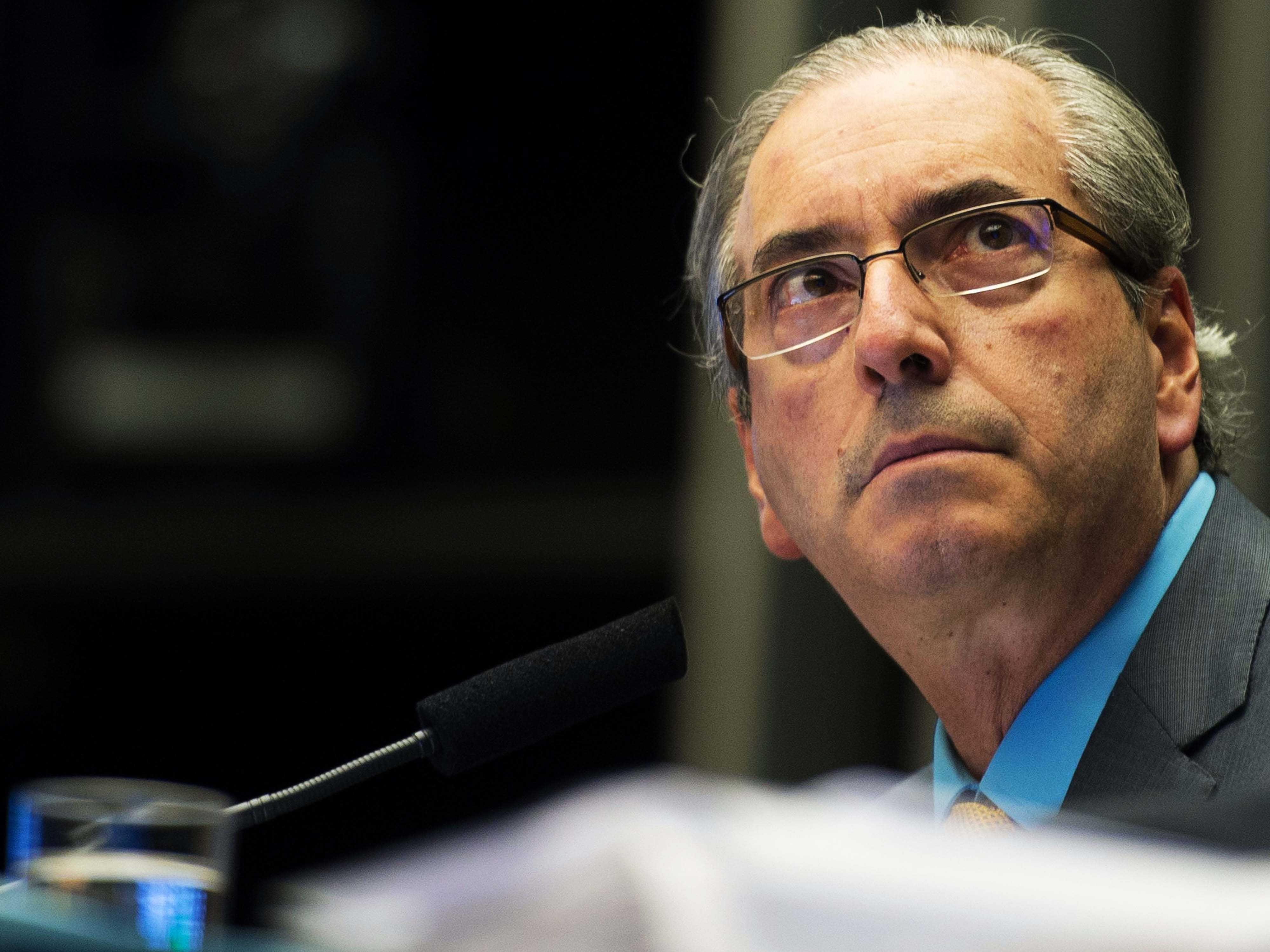 O presidente da Câmara, Eduardo Cunha (PMDB-RJ), antes da sessão para a votação da MP 665, que restringe o acesso ao seguro-desemprego, no plenário da Câmara dos Deputados, em Brasília