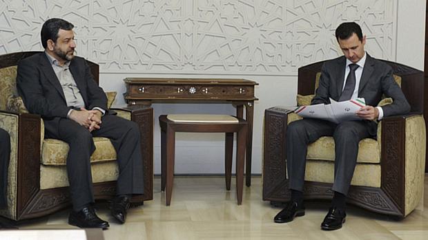 Assad recebe convite para a 16º Cúpula de Chefes de Estado do MPNA do ministro iraniano de informação, Reza Taqipour