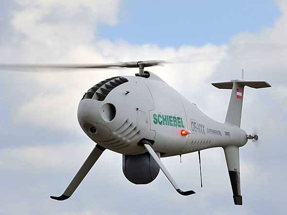 O Camcopter S-100, da austríaca Schiebel, é a única aeronave não tripulada aceita para voos de demonstração em Paris. Pode ser usado tanto em missões militares de reconhecimento como em filmagens aéreas civis O Camcopter S-100, da austríaca Schiebel, é a única aeronave não tripulada aceita para voos de demonstração em Paris. Pode ser usado tanto em missões militares de reconhecimento como em filmagens aéreas civis
