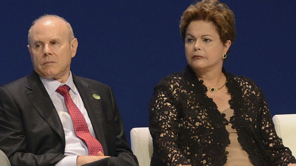 Ministro da Fazenda Guido Mantega, ao lado da presidente Dilma Rousseff durante o Encontro Nacional da Indústria, em Brasília