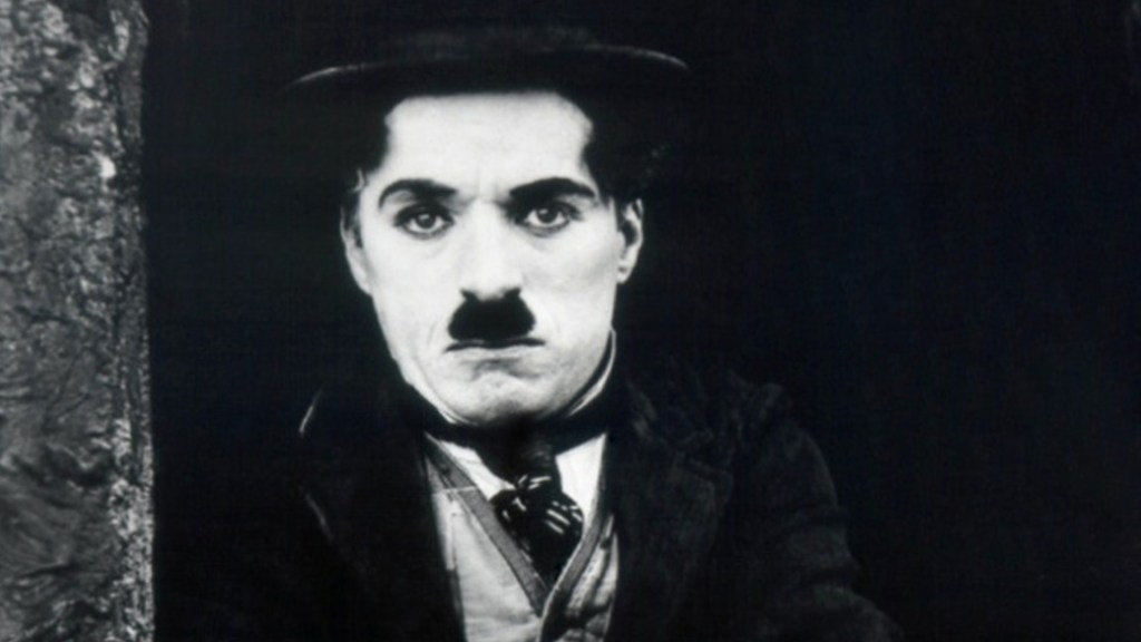 Ator e diretor Charlie Chaplin no filme 'O Garoto' de 1921