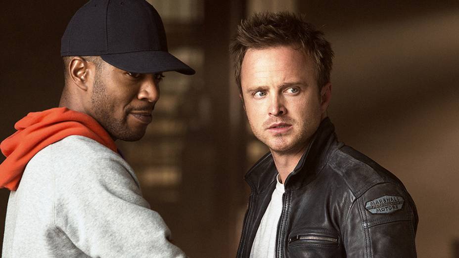 Os atores Aaron Paul e Scott Mescudi no filme Need for Speed