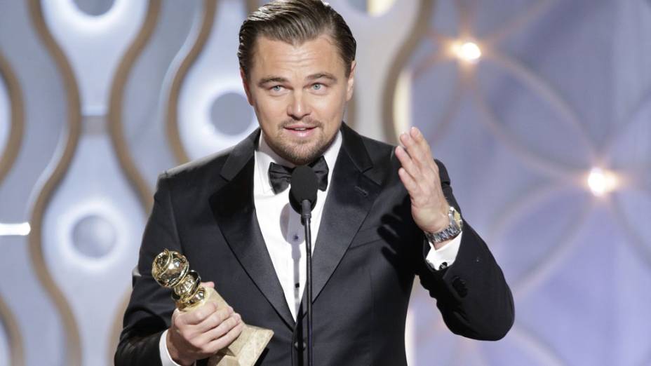 Leonardo DiCaprio leva o prêmio de melhor ator em filme cômico ou musical por O Lobo de Wall Street, de Martin Scorsese