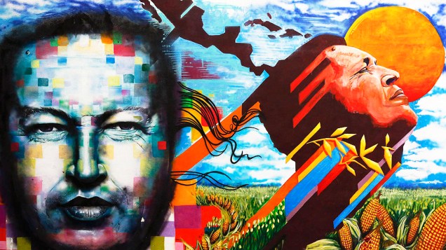 Mural com pinturas com rostos do ex-presidente Hugo Chávez é visto no centro de Caracas, na Venezuela