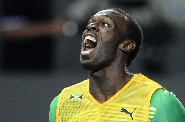 O jamaicano Usain Bolt celebra vitória nos 200 m rasos no Mundial de Atletismo em Berlim, na Alemanha, na quinta-feira. O atleta também estabeleceu novo recorde para a prova: 19s19.