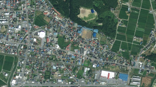 Imagem de satélite da cidade de Rikuzentakat antes do terremoto e tsunami que atingiram o Japão...