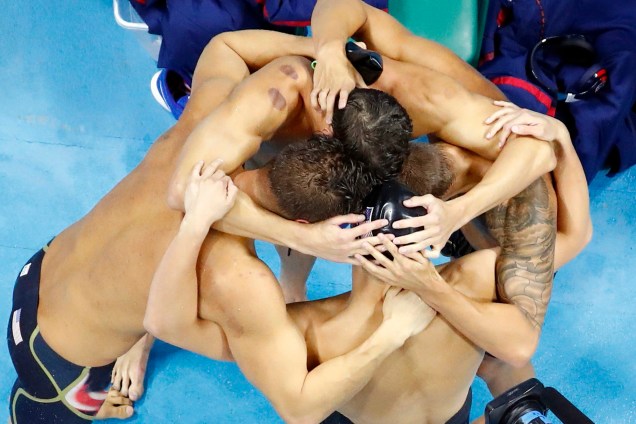 2016 Rio Olympics - Swimming - Final - Men's 4 x 100m Freestyle Relay Final - Olympic Aquatics Stadium - Rio de Janeiro, Brazil - 07/08/2016. The USA team celebrates after winning. Picture rotated 180 degrees  REUTERS/Athit Perawongmetha TPX IMAGES OF THE DAY FOR EDITORIAL USE ONLY. NOT FOR SALE FOR MARKETING OR ADVERTISING CAMPAIGNS.