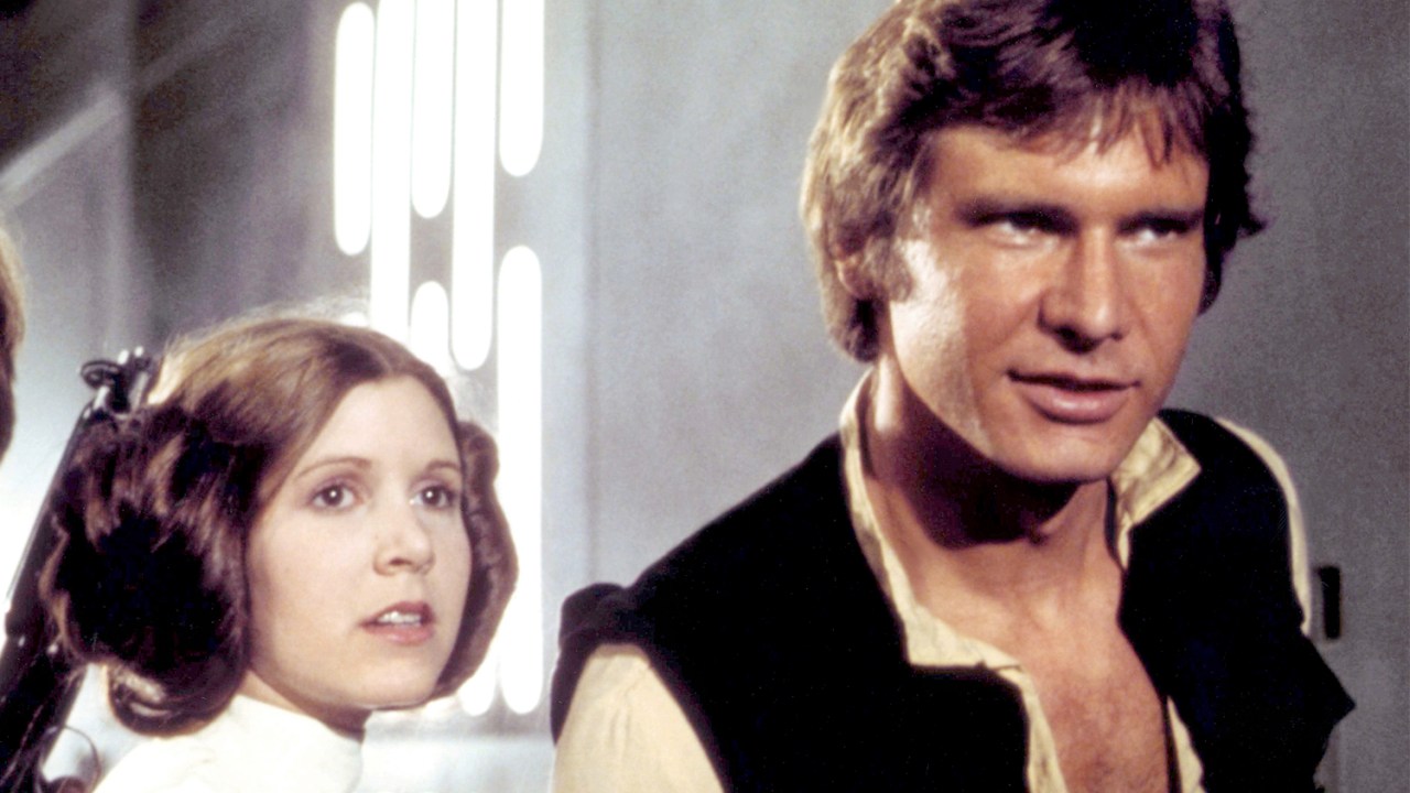 Carrie Fisher e Harrison Ford, em cena do filme 'Star Wars IV - Uma Nova Esperança' - 1977