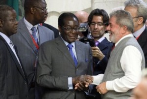 Brazil's President Lula da Silva greets Zimbabwe's President Mugabe during a food summit in Rome