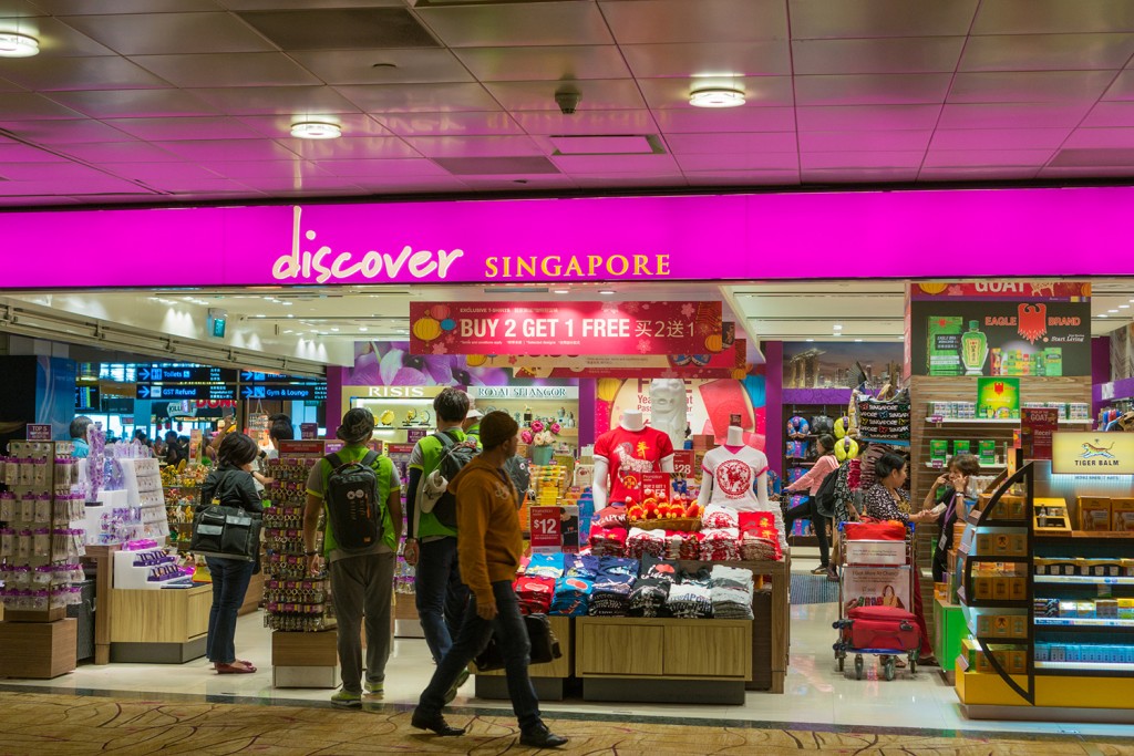 Singapore, Singapore - January 25, 2015: Glorious duty free shopping area in Changi International Airport on January 25, 2015 in Singapore. Changi Airport serves more than 100 airlines operating 6,400 weekly flights connecting Singapore to over 300 cities worldwide.