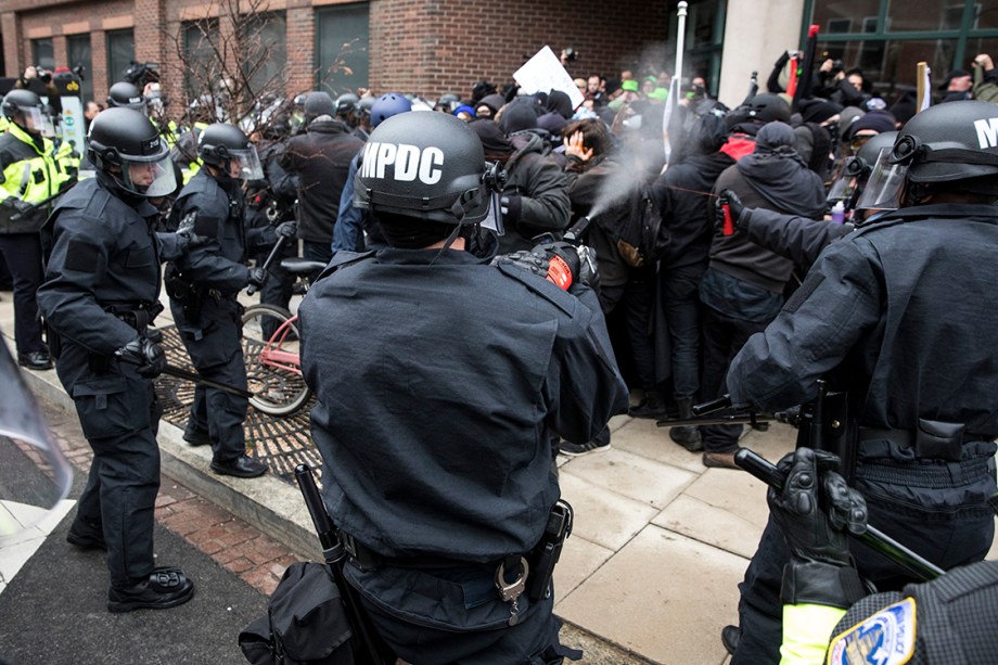 Police officers pepper spray a group of protestors before the inauguration of President-elect Donald Trump January 20, 2017 in Washington, DC.  


Donald Trump was sworn in as the 45th president of the United States Friday -- capping his improbable journey to the White House and beginning a four-year term that promises to shake up Washington and the world. / AFP PHOTO / ZACH GIBSON