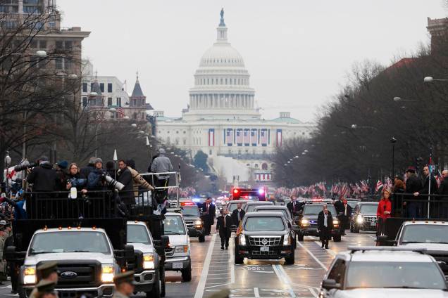 Members of the media riding in trucks (L) cover U.S. President  Donald Trump's motorcade as he participates in the inaugural parade after his swearing in at the Capitol in Washington, U.S., January 20, 2017.      REUTERS/Joshua Roberts