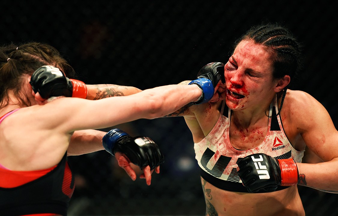LONDON, ENGLAND - MARCH 18: (L-R) Lucie Pudilova of the Czech Republic punches Lina Lansberg of Sweden in their women's bantamweight fight during the UFC Fight Night event at The O2 arena on March 18, 2017 in London, England. (Photo by Josh Hedges/Zuffa LLC/Zuffa LLC via Getty Images)