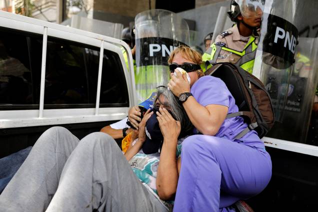 Polícia venezuelana reprime manifestações da oposição em Caracas Polícia venezuelana reprime manifestações da oposição em Caracas