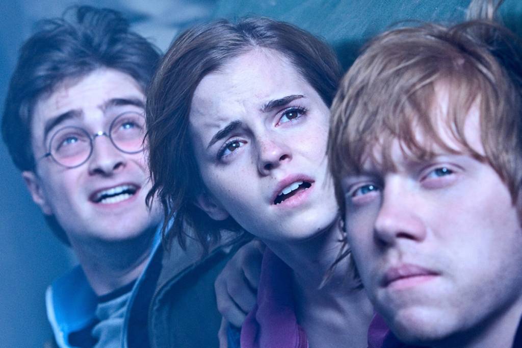 Harry, Hermione e Ron durante cena do filme Harry Potter e as Relíquias da Morte: Parte 2