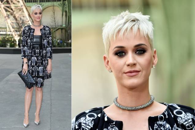 Katy Perry chamou a atenção no desfile da Chanel com um look que mesclava, em uma mesma estampa, bermuda, saia e casaco alongado. O corte moderno e a maquiagem forte no olho completaram o estilo descolado Katy Perry chamou a atenção no desfile da Chanel com um look que mesclava, em uma mesma estampa, bermuda, saia e casaco alongado. O corte moderno e a maquiagem forte no olho completaram o estilo descolado