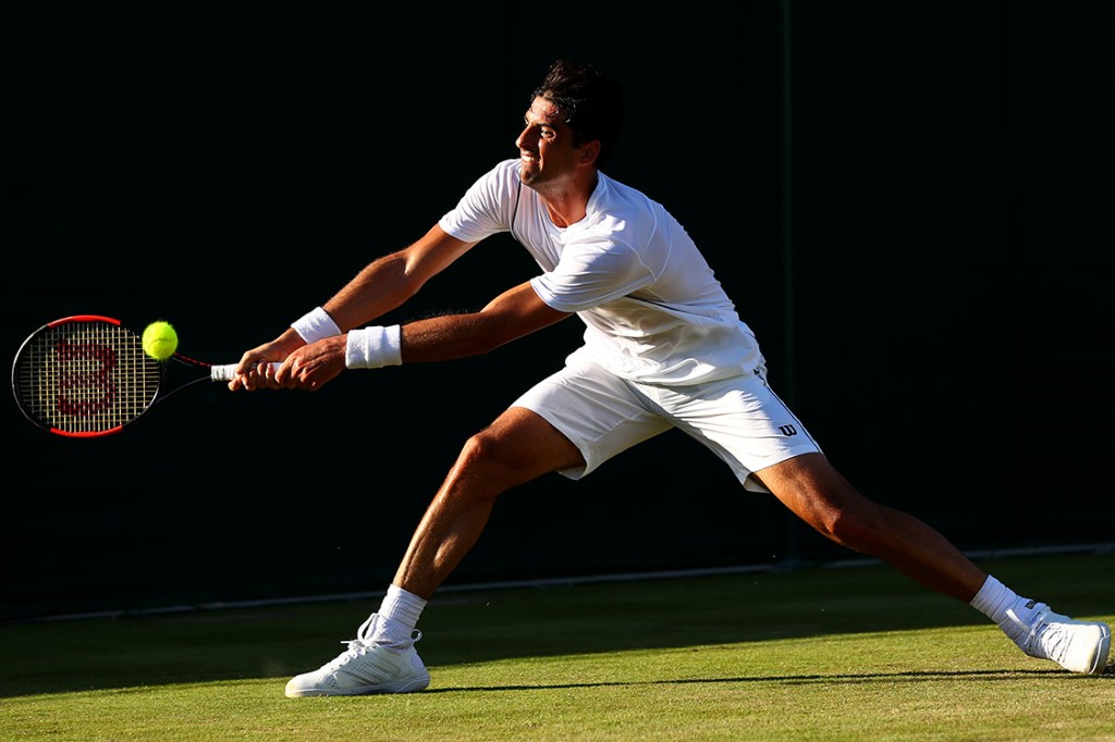 Tenista brasileiro, Thomaz Belucci, durante partida contra o austríaco Sebastian Ofner, válida pelo Wimbledon em Londres, Inglaterra