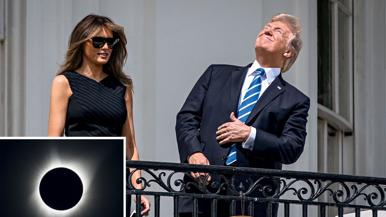 President Donald Trump and first lady Melania Trump view the solar eclipse from the Truman balcony of the White House, in Washington, Aug. 21, 2017. For the first time since 1918, a solar eclipse will travel across the entire U.S. on Monday. Millions of people ventured to a spot on the path of totality hoping to catch a glimpse of the rare celestial event. (Al Drago/The New York Times/Fotoarena)