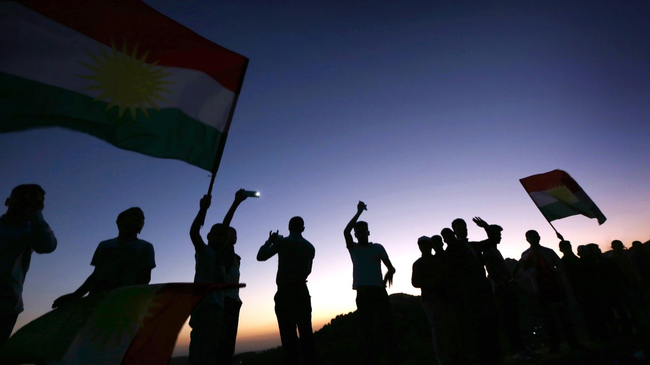 Imagens do dia - Curdistãos iraquianos se unem para encorajar as eleições