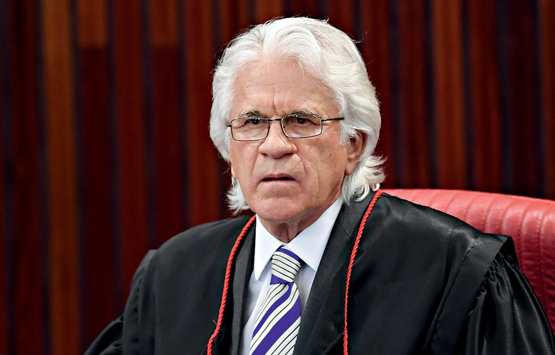 Supreme Electoral Court (TSE) Judge Napoleao Nunes Maia attends a session to decide whether to invalidate the 2014 presidential election because of illegal campaign funding, in Brasilia, on June 6, 2017. At issue are allegations that when then president Dilma Rousseff ran for re-election in 2014, with Temer as vice president, their ticket was financed by undeclared funds or bribes. Both Temer and Rousseff deny any wrongdoing. / AFP PHOTO / EVARISTO SA