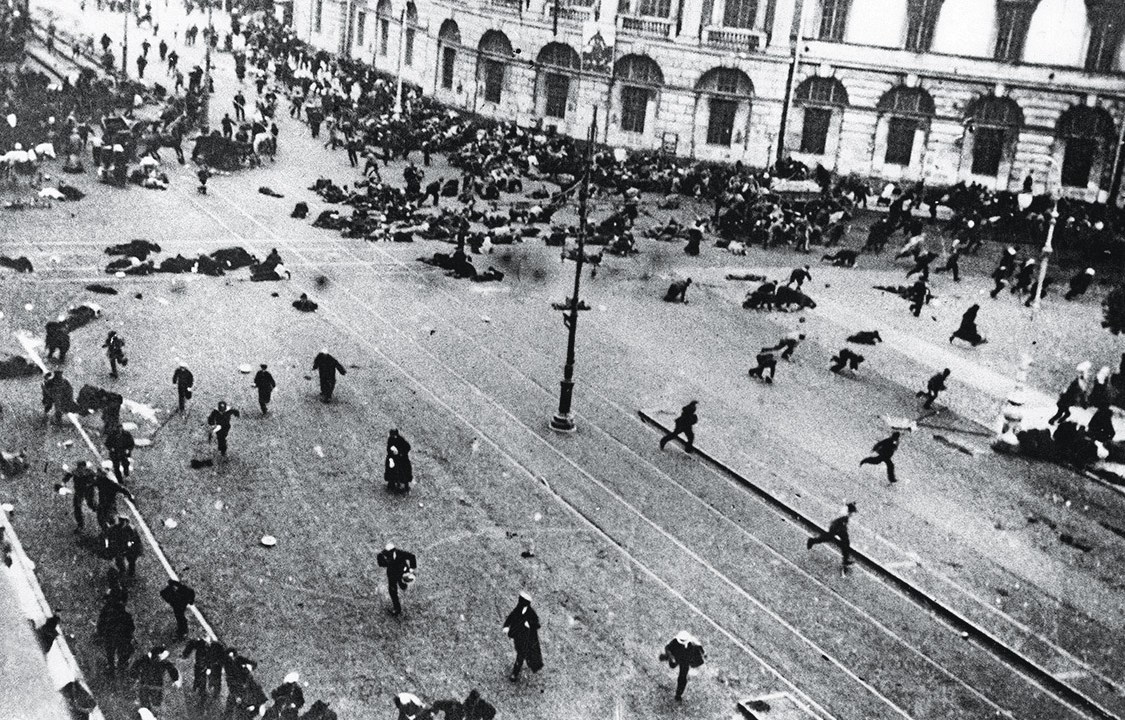 July 1917: Crowds flee from street fighting between Leninists and troops loyal to the the Kerensky provisional government outside the Duma (Russian State Assembly) on the corner of Nevsky Prospect, opposite the Saltikov-Schredin Library, Moscow, during the Russian Revolution. (Photo by Bulla/Slava Katamidze Collection/Getty Images)