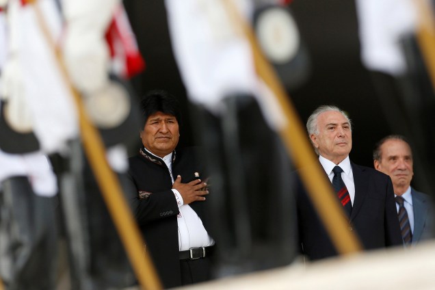 Bolivia's President Evo Morales listens to his national anthem next to his Brazilian counterpart Michel Temer at the Planalto Palace in Brasilia, Brazil December 5, 2017. REUTERS/Adriano Machado