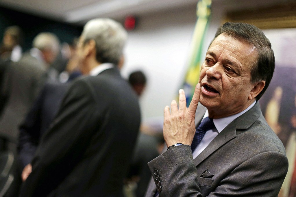 Brazilian President and presidential candidate Jair Bolsonaro (R) speaks next to Brazilian former president (2003-2010) and presidential candidate for the leftist Workers Party (PT), Luiz Inacio Lula da Silva (L), during a televised presidential debate in Sao Paulo, Brazil, on October 16, 2022. - President Jair Bolsonaro and former President Luiz Inácio Lula da Silva face each other this Sunday night in the first face-to-face debate, in which they will try to take advantage 14 days before the second round of the presidential elections in Brazil. (Photo by NELSON ALMEIDA / AFP)