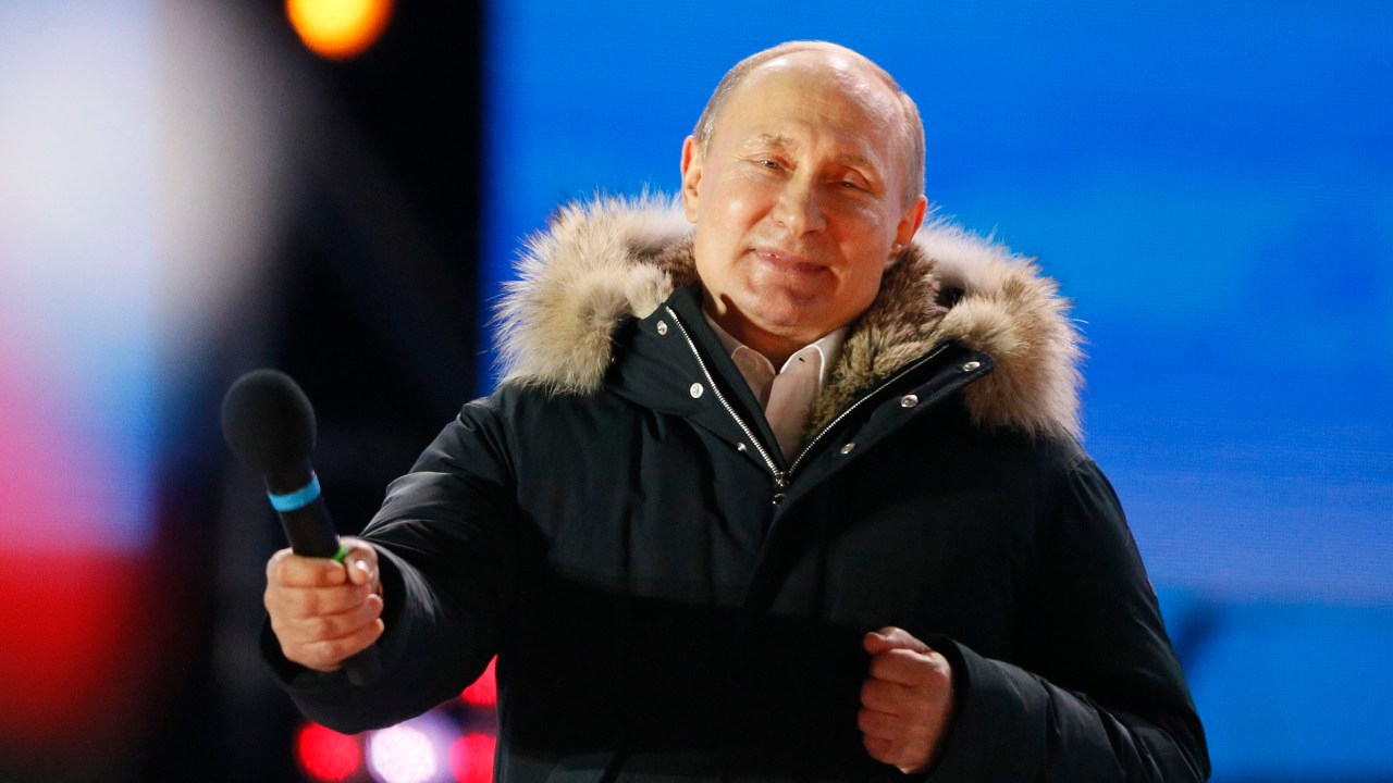 Russian President and Presidential candidate Vladimir Putin attends a rally and concert marking the fourth anniversary of Russia's annexation of the Crimea region, at Manezhnaya Square in central Moscow, Russia March 18, 2018. REUTERS/