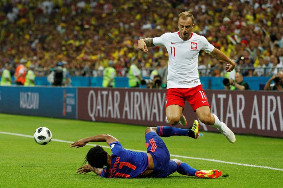 Soccer Football - World Cup - Group H - Poland vs Colombia - Kazan Arena, Kazan, Russia - June 24, 2018   Poland's Kamil Grosicki in action with Colombia's Juan Cuadrado      REUTERS/