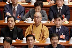 Xuecheng, the delegate of the CPPCC and the abbot of the Longquan Temple, attends the opening session of the CPPCC in Beijing