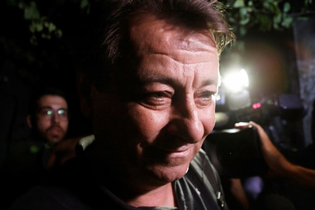 O ex-guerrilheiro italiano Cesare Battisti deixa a sede da Polícia Federal em São Paulo - 13/03/2015