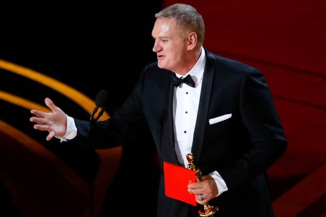 O compositor John Ottman recebe o Oscar de melhor edição de som, durante cerimônia de premiação realizada em Los Angeles - 24/02/2019