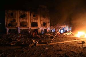 Flames are burning at the scene where a suicide car bomb exploded targeting a Mogadishu hotel in a business center in Maka Al Mukaram street in Mogadishu