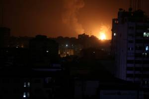 Smoke and flame are seen during an Israeli air strike in Gaza