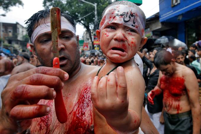 A child reacts during a Muharram procession to mark Ashura in Kolkata