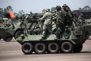 Members of the National Guard and Bolivarian militia take part in a military exercise in Garcia Hevia airport in La Fria